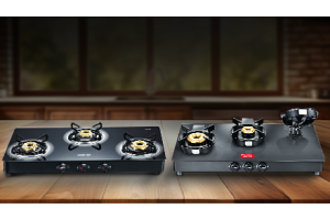 Two black Prestige glass-top gas stoves: 3-burner and 2-burner