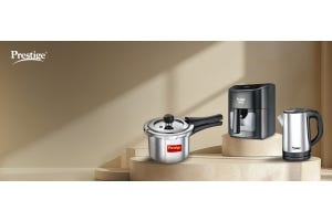 Prestige kitchen appliances, featuring a stainless steel pressure cooker, air fryer, and kettle, displayed in a modern setup for essential home cooking in 2025.