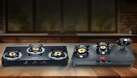 Two black Prestige glass-top gas stoves: 3-burner and 2-burner