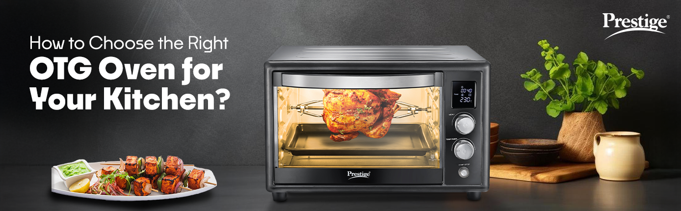 Prestige OTG oven cooking chicken with rotisserie, surrounded by plants and kitchenware